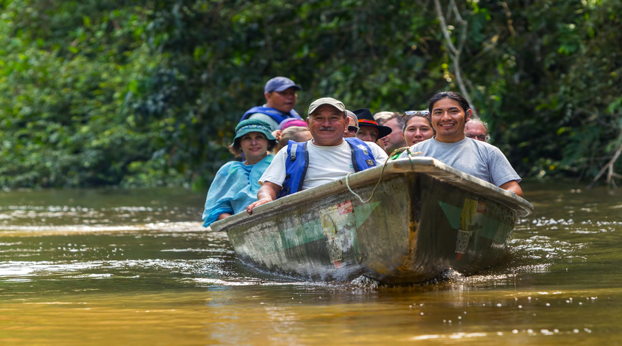 Cuyabeno, Ecuador Group Of Tourists In The Canoe Crossing Cuyabeno River, South America In Cuyabeno