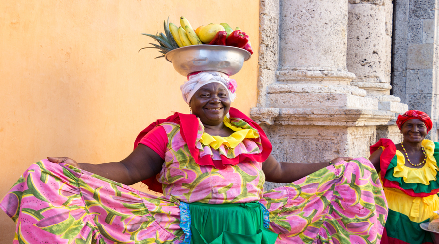 A-woman-palenquera-with-a-metal-basket-with-fruits