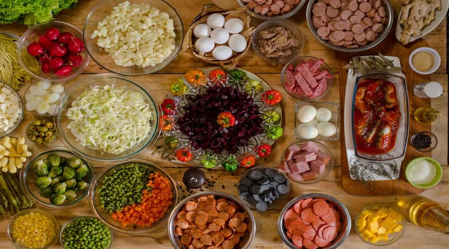 Assorted-sausages-and-vegetables-over-a-table-ready-to-make-fiambre-a-traditional-festival-dish-for-All-Saints-Day-in-Guatemala-city.