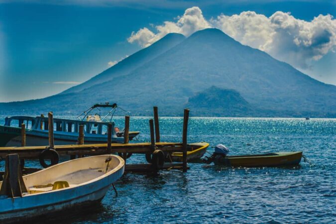 Boats-docked-in-Lake-Atitlan-Guatemala-with-volcanoes-in-the-background