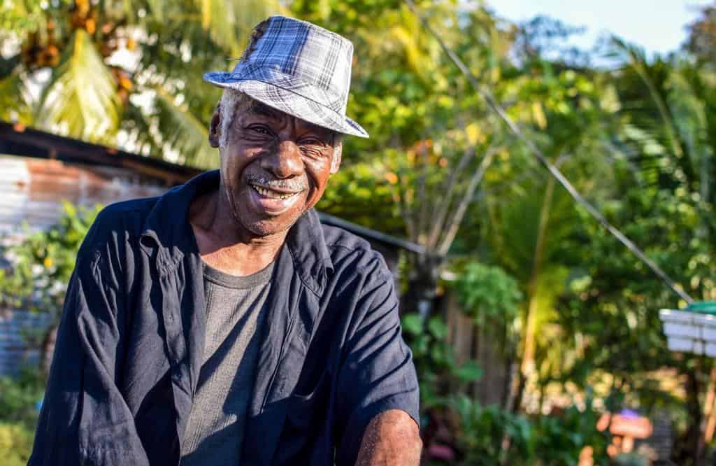 Garifuna-man-smiles-into-the-camera-on-March-7-2015-in-Livingston-Guatemala.-Garifuna-are-the-group-of-indigenous-people-of-African-descent-in-Central-America