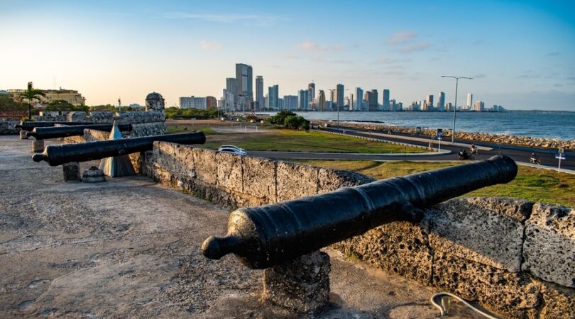 Historic-military-fortification-with-canons-and-a-background-of-the-modern-part-of-Cartagena