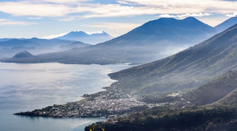 View-of-Lake-Atitlan-5-volcanoes-San-Pedro-la-Laguna-in-early-morning.-View-from-Indian-Nose-San-Juan-La-Laguna-in-Guatemalan-highlands.