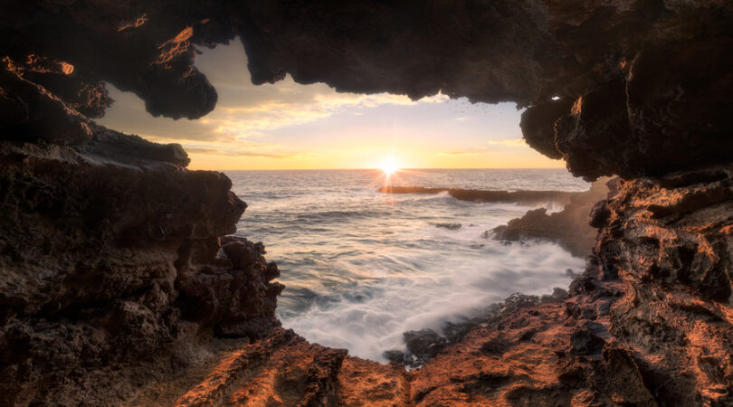 Watching-the-Sunset-through-the-wonderful-Ana-Kakenga-Cave-on-Rapa-Nui-Isla-de-Pasca-Easter-Island