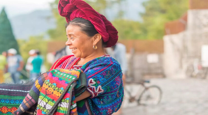 Portrait-of-the-woman-selling-goods-on-the-street-of-touristic-town-of-Panajachel-in-Guatemala