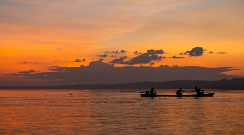 sunset-with-dolphin-in-silhouette-on-the-amazon-river-in-Puerto-Narino