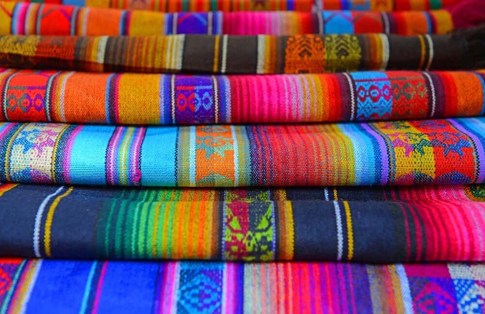 The typical andean fabrics sold on the handicrafts market of Otavalo, Ecuador