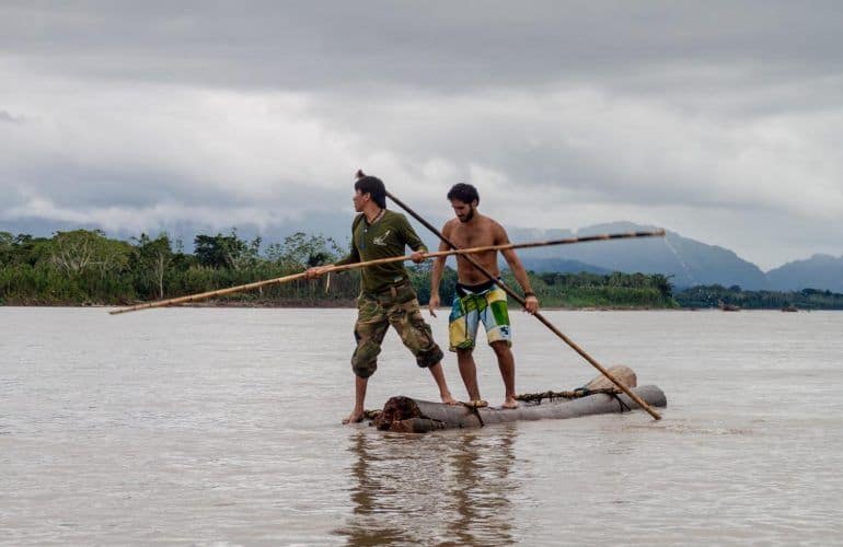 Tourist-with-a-tour-guide-on-Beni-river-in-Madidi-National-Park-Bolivia