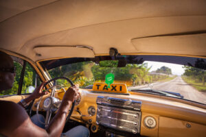 nterior-of-a-classical-American-car-serving-as-a-taxi.-The-taxi-is-heading-to-El-Cobre-crossing-the-country-around-Santiago-de-Cuba-Cuba