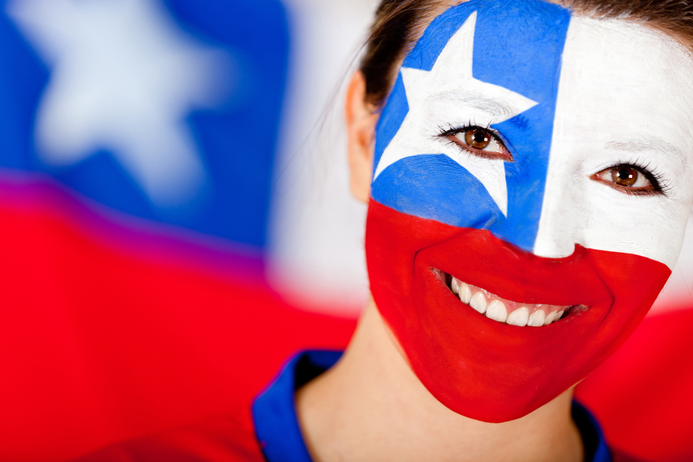 Chilean woman with the flag painted on her face