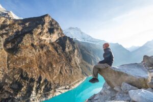 Hiker-admires-the-lake-Paron-in-Cordillera-Blanca-Peru-South-America.