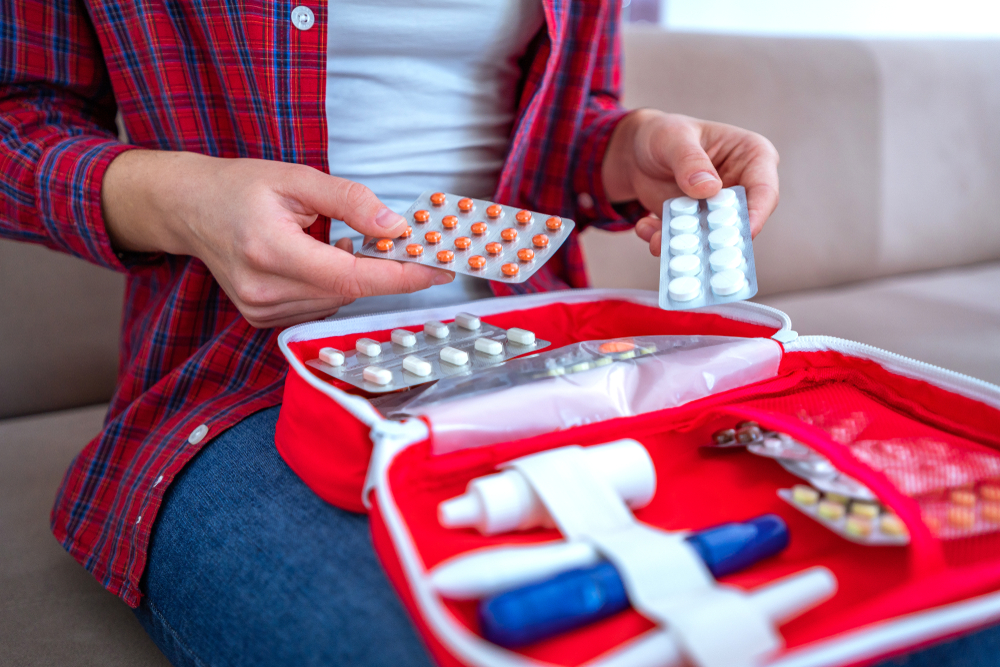 Medical first aid kit with medicine and pills for pain and illness