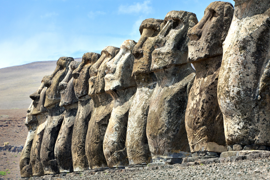 Ten stone moai standing in Easter Island in sunshine