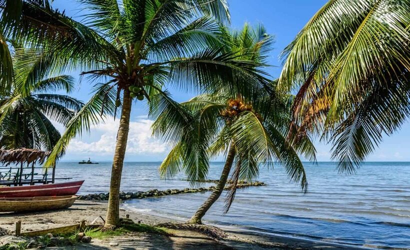 Boats-on-beach-at-Caribbean-town-of-Livingston-Guatemala_496362817-820x500