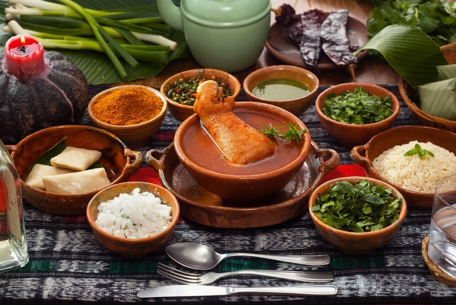 Kak-ik-traditional-Guatemalan-dish-made-with-turkey-tomato-and-many-aromatic-herbs-served-with-white-rice-and-small-tamales