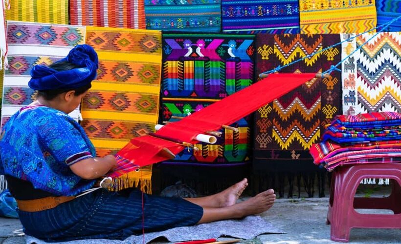 Maya-woman-is-weaving-with-her-waist-loom-on-a-street-in-San-Antonio-Palopo-Guatemala._1538880245-820x500